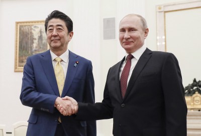 Abe, Putin vow to speed up peace treaty talks, hint at challenges