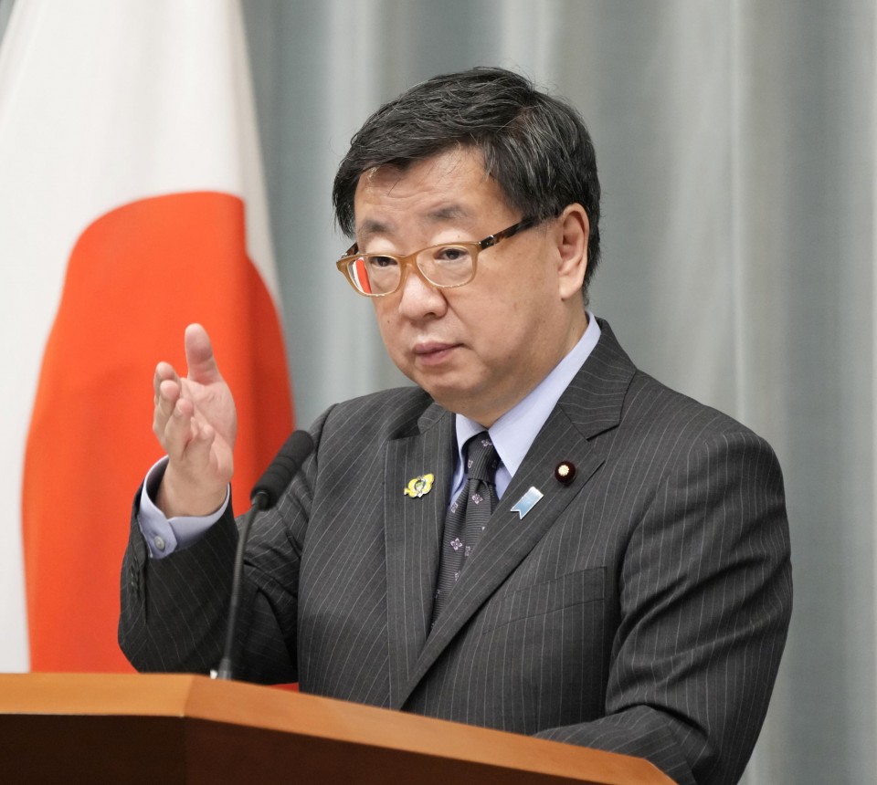 Japanese Chief Cabinet Secretary Hirokazu Matsuno attends a press conferenc...