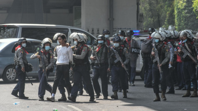 Myanmar media say woman shot dead during protests, but reports conflict