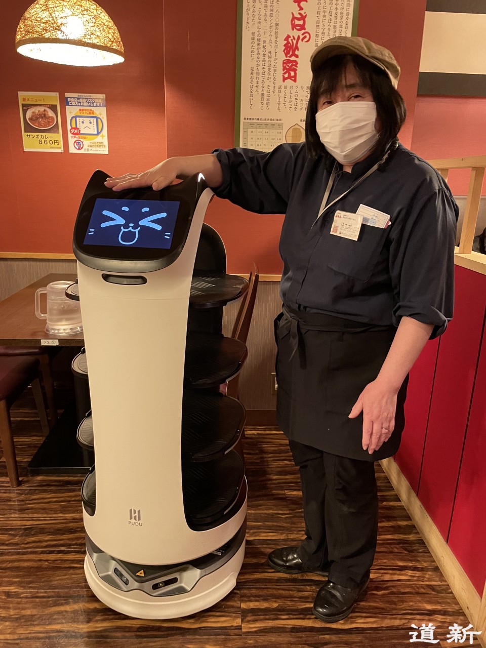 robot serving dishes at noodle restaurant