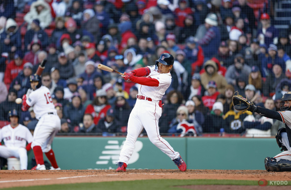 Masataka Yoshida of the Boston Red Sox walks back to the dugout