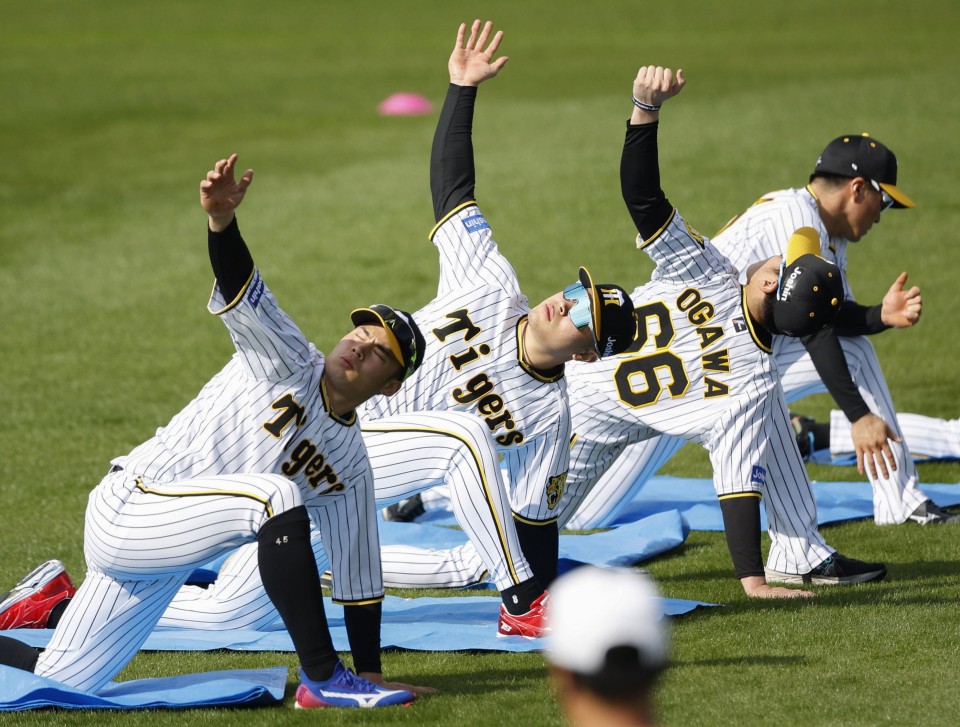 Nippon Ham Fighters manager Tsuyoshi Shinjo unveils his uniform